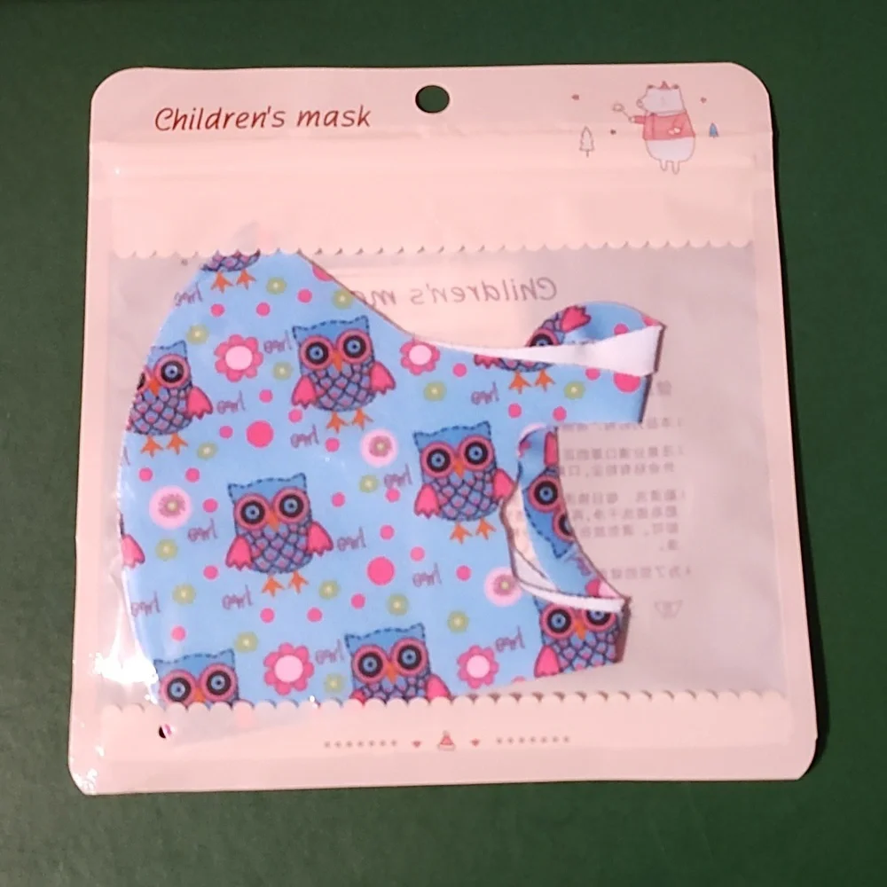 Children's re Usable face mask new in package never opened